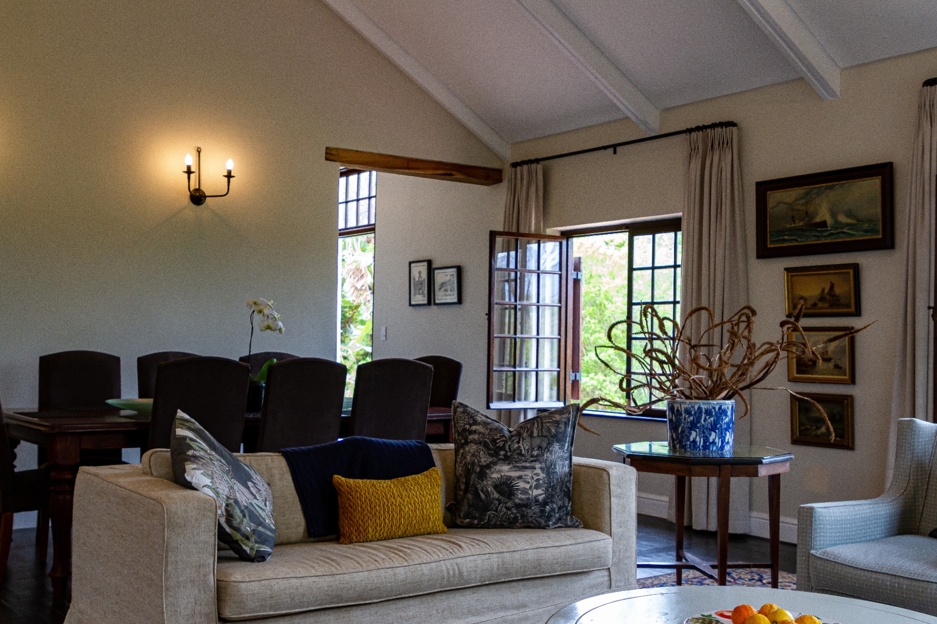 Merle Manor House lounge with linen sofas and artwork