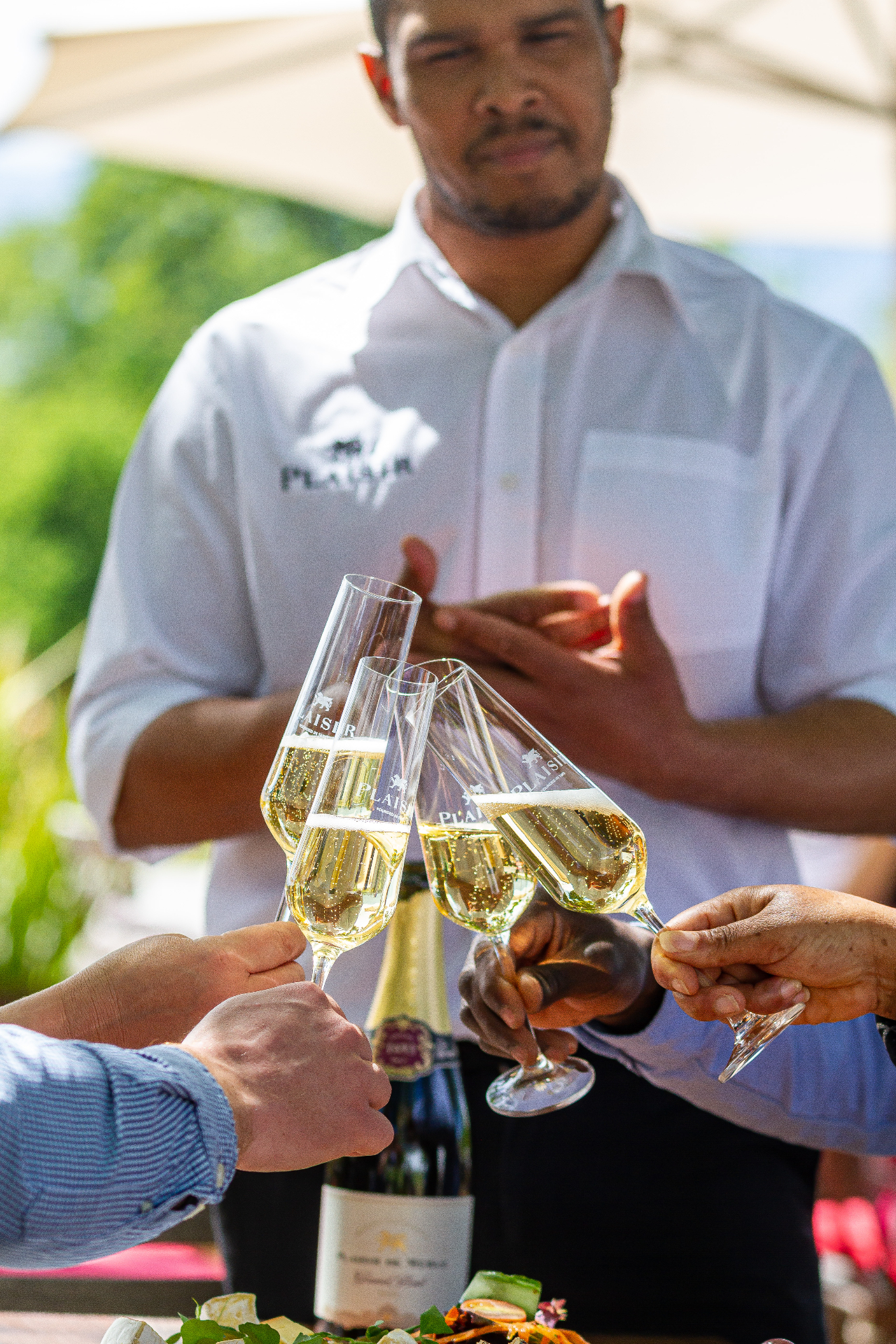 Guests toasting with Plaisir MCC on the tasting room terrace