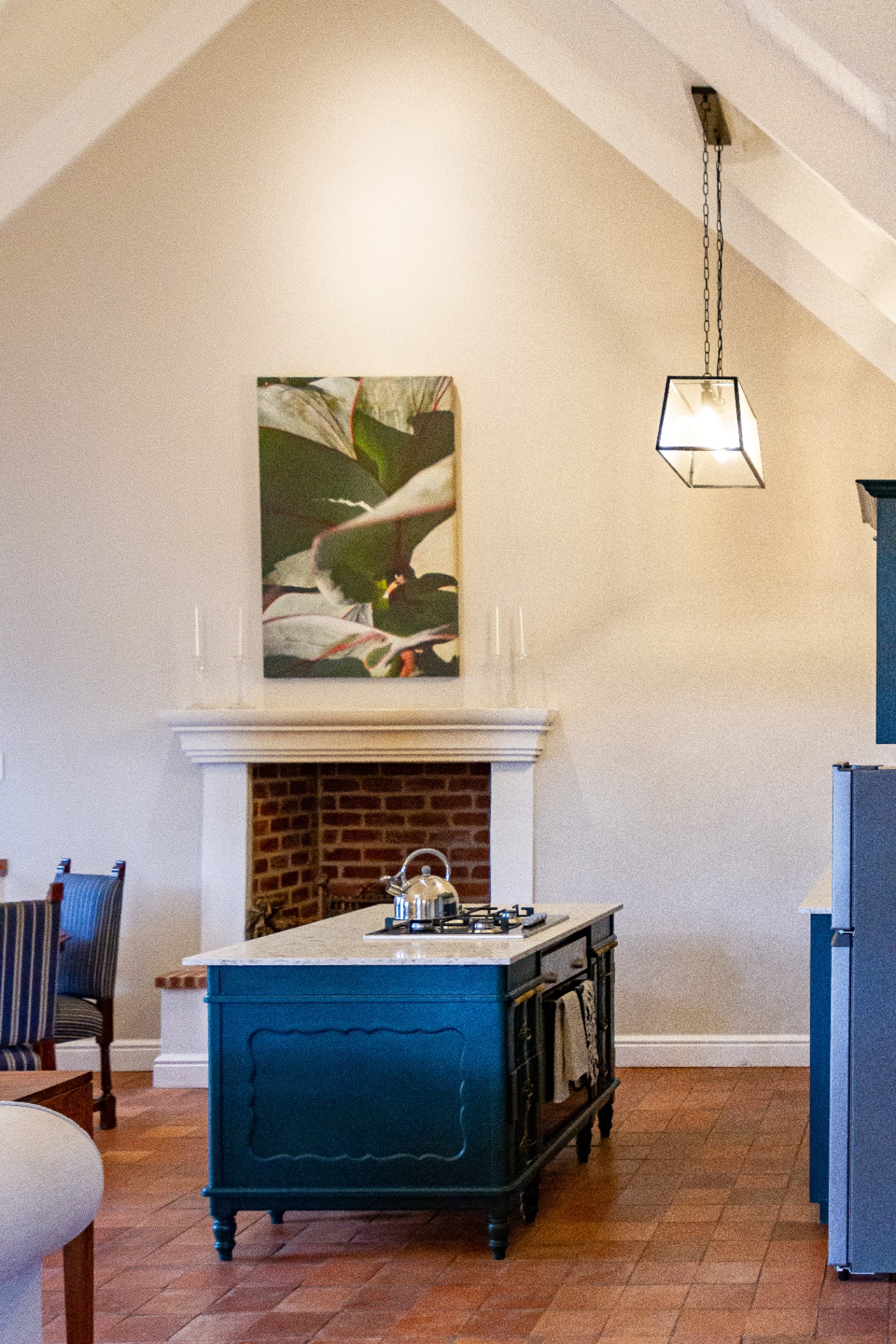 Forest Cottage open-plan kitchen with island and fireplace