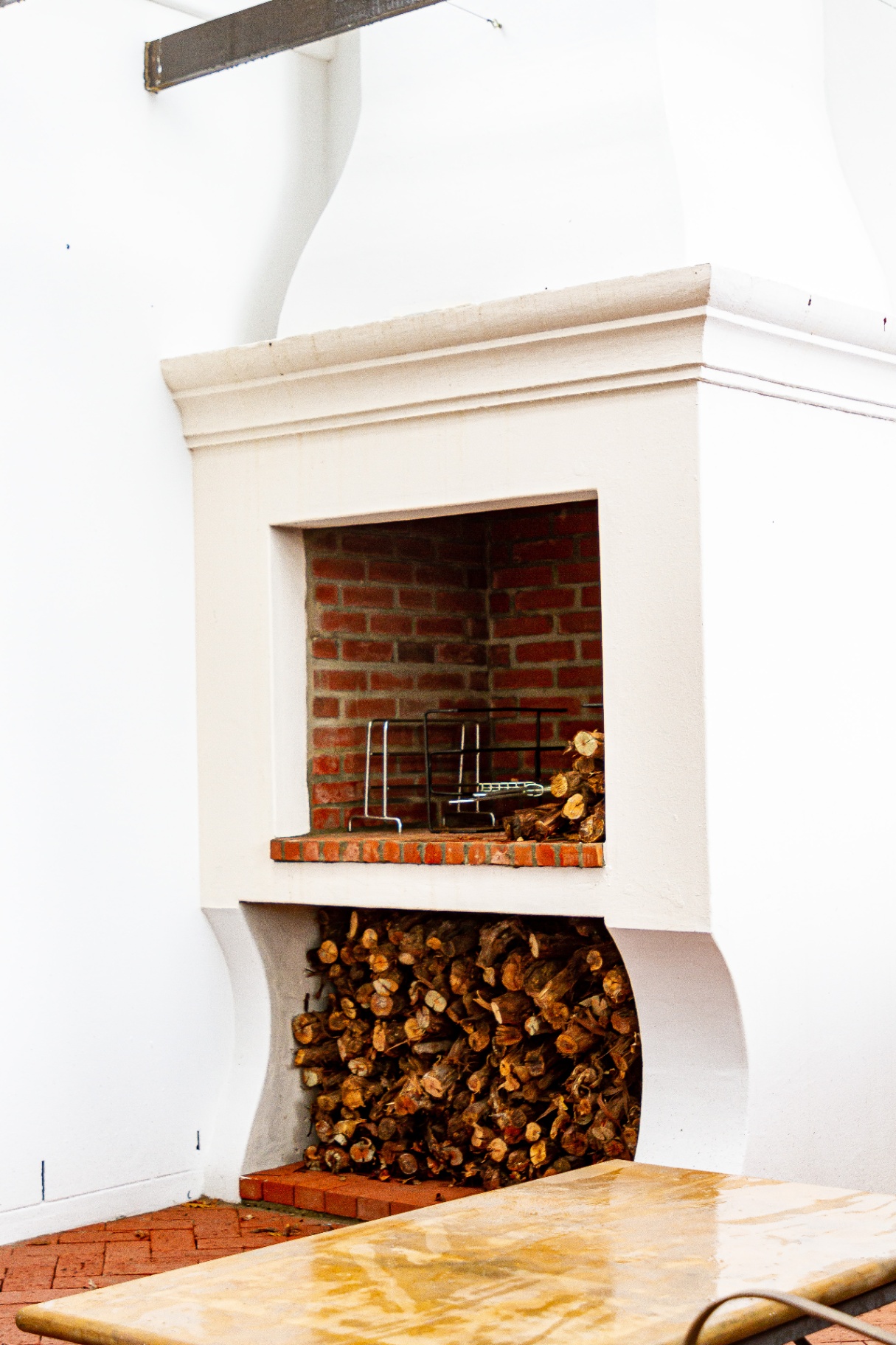 Forest Cottage covered braai with chimney and wood store