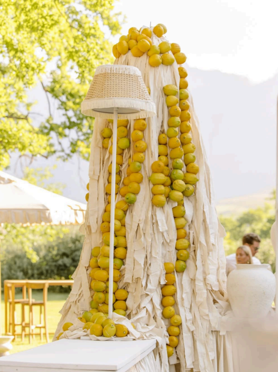Lemon-toned sculptural decor installation set outdoors on the lawn