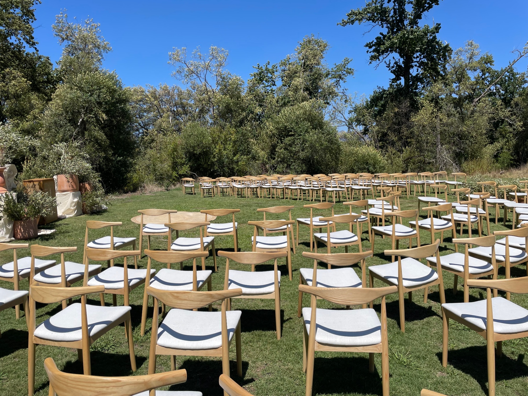 Outdoor ceremony seating arrangement in garden setting