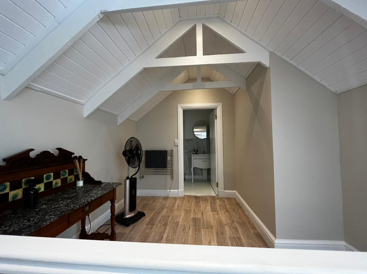 Old Mill Suite loft landing with vaulted ceiling and en-suite