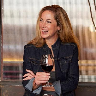 Rose Jordaan with a glass of red wine
